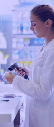 Pharmacist from canadian pharmacy scanning prescription drug bottle